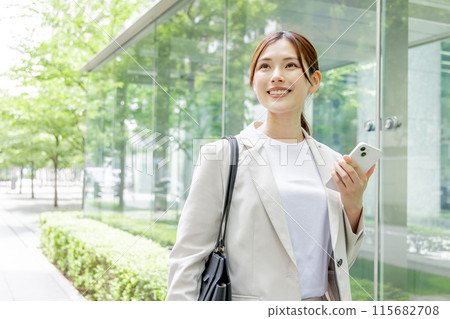 Young woman searching on her smartphone Young woman searching on her smartphone 115682708