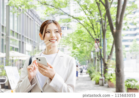 Young woman searching on her smartphone Young woman searching on her smartphone 115683055