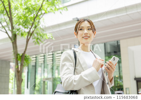 Young woman searching on her smartphone Young woman searching on her smartphone 115683068