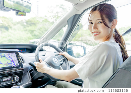 Young woman driving Young woman driving 115683136