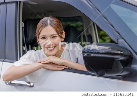Young woman driving Young woman driving 115683141