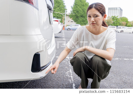 Young woman driving accident suicide rub scratching wound 115683154