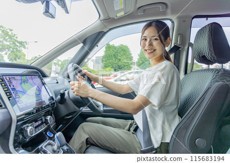 Young woman driving 115683194