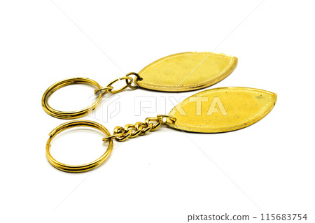 A picture of golden earrings with white background 115683754