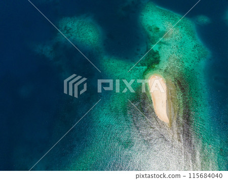 White sandbar with azure water and coral reefs. Naked Island. Britania Island. Surigao del Sur, Philippines. 115684040