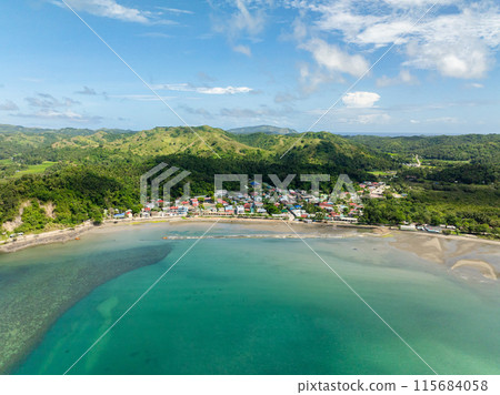 Residential aera and buildings in Santa Fe. Turquoise sea water at shoreline. Tablas, Romblon. Philippines. Residential aera and buildings in Santa Fe. Turquoise sea water at shoreline. Tablas, Romblon. Philippines. 115684058
