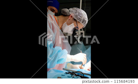 Modern clinic surgical operation skilled hands of doctors save and change lives. Technologies professionalism dedication modern medicine doctor doing operation hospital team assistants. 115684193
