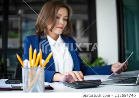 beautiful smiling businesswoman working with documents beautiful smiling businesswoman working with documents 115684740