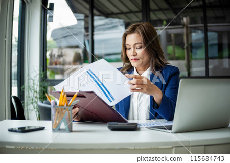 beautiful smiling businesswoman working with documents 115684743