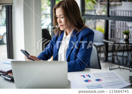 beautiful smiling businesswoman working with documents beautiful smiling businesswoman working with documents 115684745