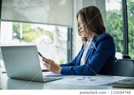 beautiful smiling businesswoman working with documents 115684746