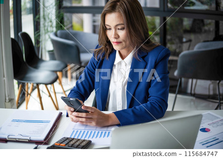 beautiful smiling businesswoman working with documents 115684747