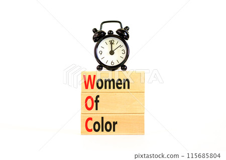 WOC women of color symbol. Concept words WOC women of color on beautiful wooden blocks. Beautiful white background. Alarm clock. Business WOC women of color social issues concept. Copy space. WOC women of color symbol. Concept words WOC women of color on beautiful wooden blocks. Beautiful white background. Alarm clock. Business WOC women of color social issues concept. Copy space. 115685804
