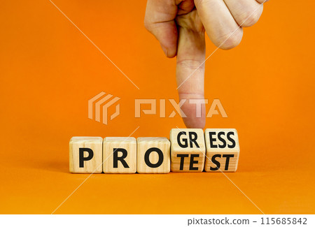 Progress vs protest symbol. Concept word Progress Protest on beautiful wooden cubes. Beautiful orange table orange background. Businessman hand. Business progress vs protest concept. Copy space. 115685842