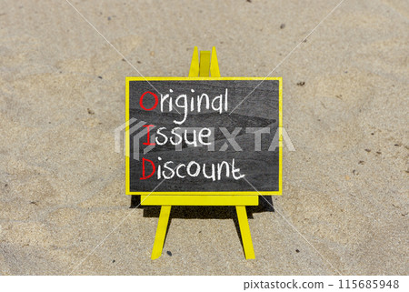 OID original issue discount symbol. Concept words OID original issue discount on beautiful yellow blackboard. Beautiful sand background. Business OID original issue discount concept. Copy space. OID original issue discount symbol. Concept words OID original issue discount on beautiful yellow blackboard. Beautiful sand background. Business OID original issue discount concept. Copy space. 115685948