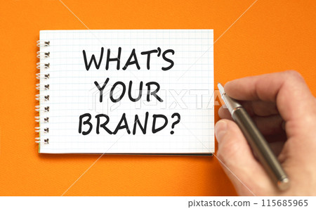 Branding what is your brand symbol. Concept words What is your brand on beautiful white note. Beautiful orange background. Businessman hand. Business branding what is your brand concept. Copy space. Branding what is your brand symbol. Concept words What is your brand on beautiful white note. Beautiful orange background. Businessman hand. Business branding what is your brand concept. Copy space. 115685965