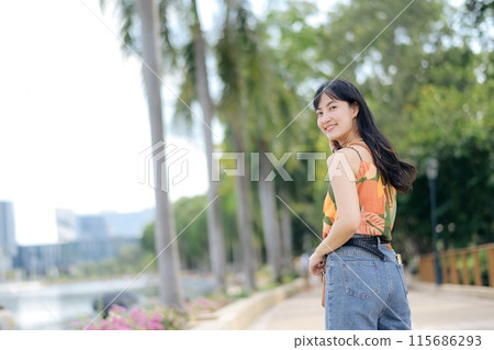 Attractive girl in a modern urban scene, alone but exuding happiness, capturing essence of carefree living. Attractive girl in a modern urban scene, alone but exuding happiness, capturing essence of carefree living. 115686293