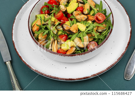 Salad with mussels, herbs and vegetables. 115686427