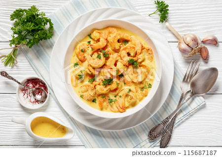 Sauteed Shrimp in creamy saffron sauce, top view 115687187
