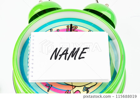 NAME word on a business card on the watch face NAME word on a business card on the watch face 115688019