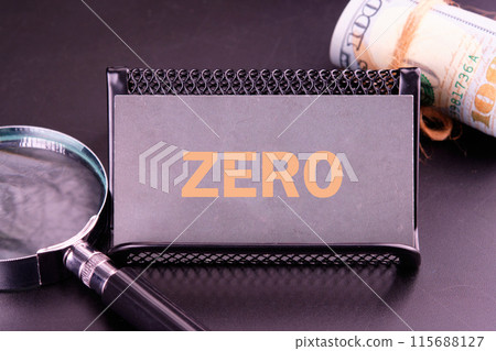 Zero, word written on a gray business card in golden letters 115688127
