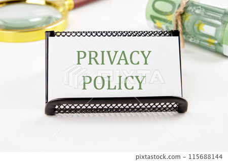 Privacy Policy Text Appearing on a white card on a white background in a composition with EURO bills and a magnifying glass 115688144