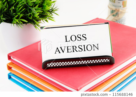 Business concept. The inscription Loss Aversion on the card on the stand 115688146