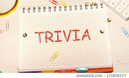 Finance and economics concept. The text is written - TRIVIA in a notebook on the desk of a businessman, manager 115688157