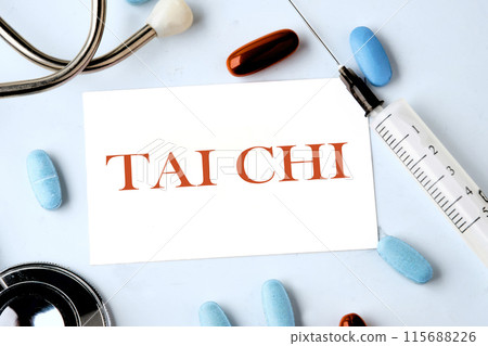 Sports and signal. Sign tai chi on a business card on a blue background with a stethoscope, pills and a syringe in the composition Sports and signal. Sign tai chi on a business card on a blue background with a stethoscope, pills and a syringe in the composition 115688226