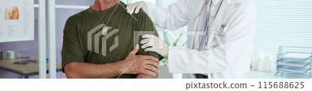 Doctor Examining Injured Arm In Hospital Doctor Examining Injured Arm In Hospital 115688625