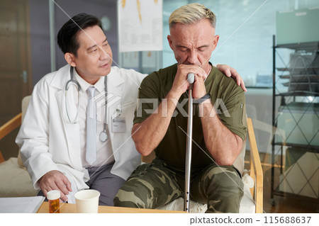 Doctor Supporting Soldier In His Rehabilitation Doctor Supporting Soldier In His Rehabilitation 115688637