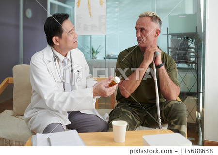 Doctor Prescribing Pills To Soldier 115688638