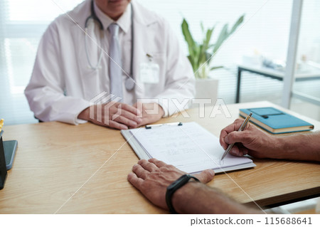 Patient Signing Documents For Treatment 115688641