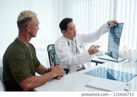 Doctor Talking About Diagnosis To Soldier Doctor Talking About Diagnosis To Soldier 115688713