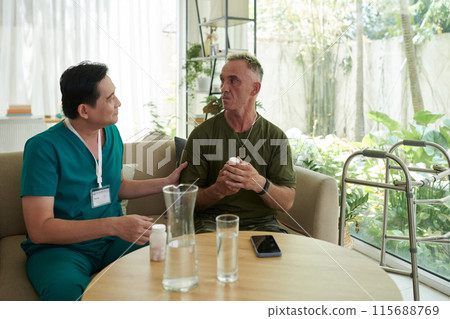 Doctor Talking To Soldier At Hospital 115688769
