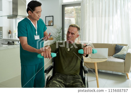 Soldier Training with Dumbbells Together with Doctor Soldier Training with Dumbbells Together with Doctor 115688787