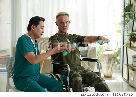 Doctor Showing Workout Exercises to Soldier 115688789