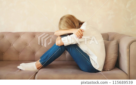 Upset sad crying woman while experiencing mental suffering, depression, fatigue, emotional stress 115689539