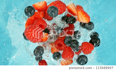 Freeze Motion of Berries Falling into Water, Splashing. 115689947