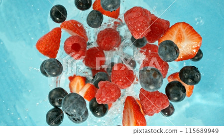 Freeze Motion of Berries Falling into Water, Splashing. 115689949