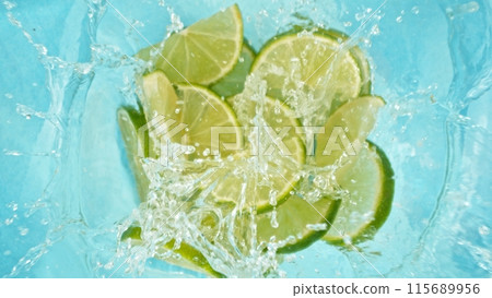 Freeze Motion of Lime Slices Falling into Water, Splashing. 115689956
