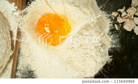 Freeze Motion of Falling Raw Egg into Flour. Freeze Motion of Falling Raw Egg into Flour. 115689966