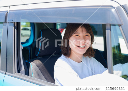 A young woman riding a car A young woman riding a car 115690831