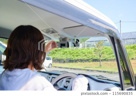 A young woman riding a car 115690835
