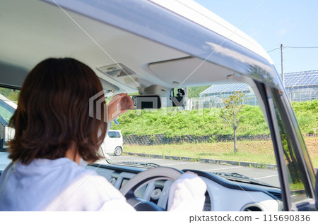 A young woman riding a car 115690836