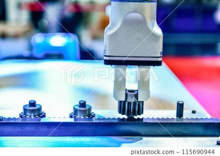 Modern Robot Arm automation system moving metal gear parts in factory, industrial robot concept 115690944