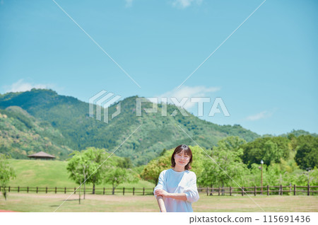 Outdoors, refreshing woman, park, spring, health, exercise Outdoors, refreshing woman, park, spring, health, exercise 115691436