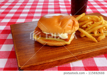 Fish burger, french fries and coke 115692688