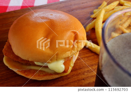 Fish burger, french fries and coke 115692703