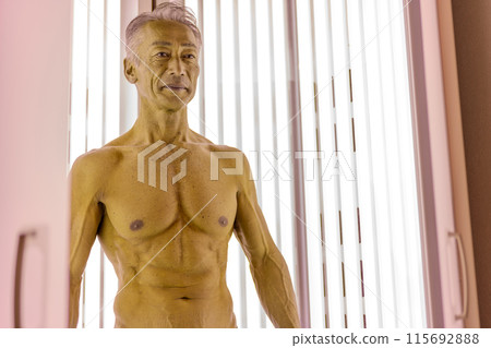 Tanning salon senior man 115692888